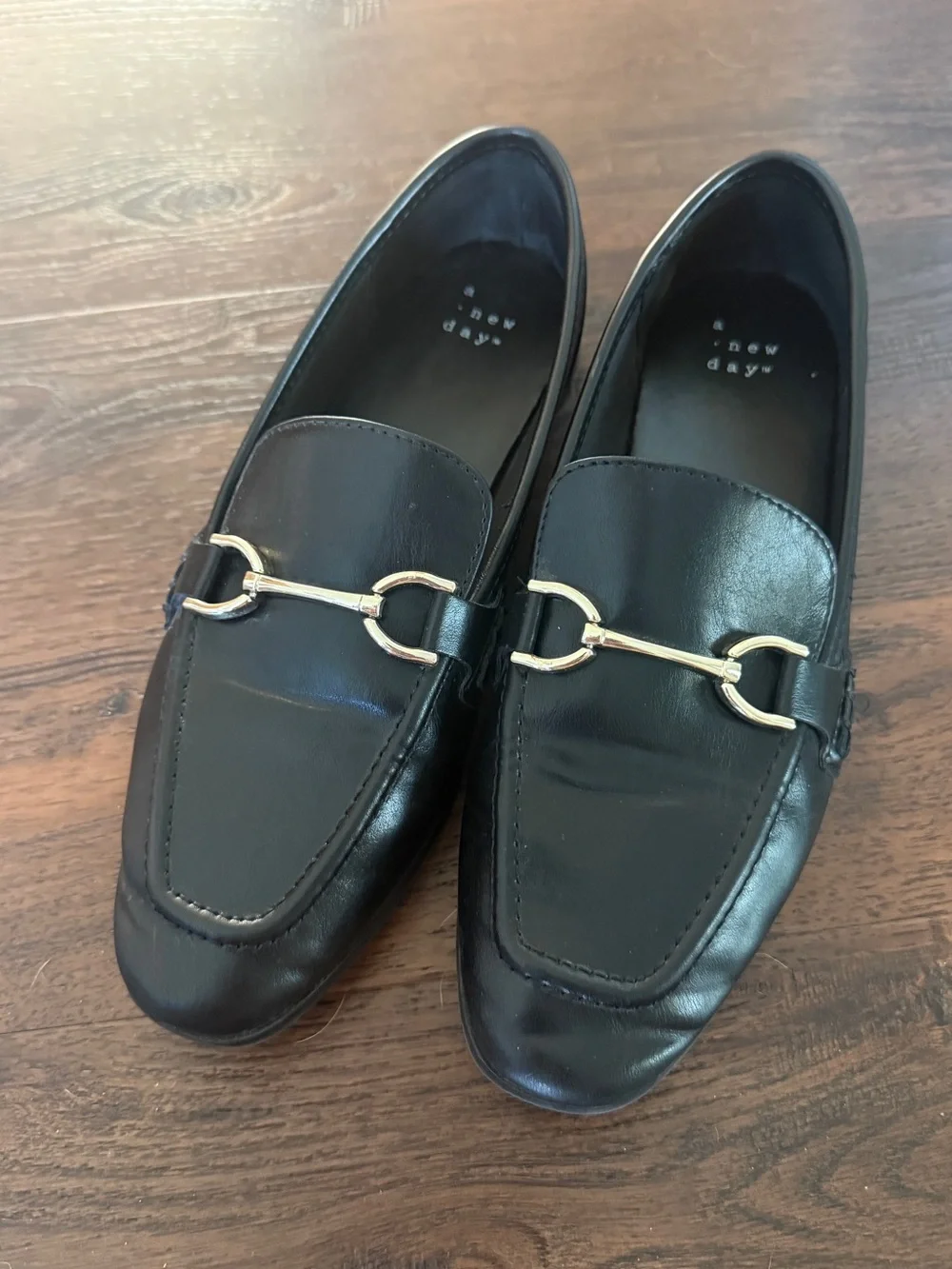 A New Day black leather loafers with silver/gold bit hardware